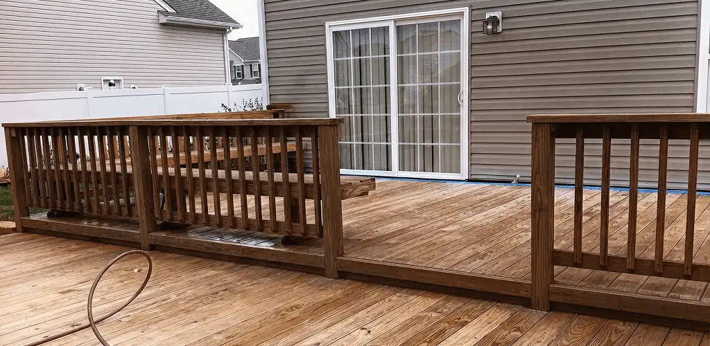 Deck sealing service protecting a backyard wood deck and railings in Columbia, SC