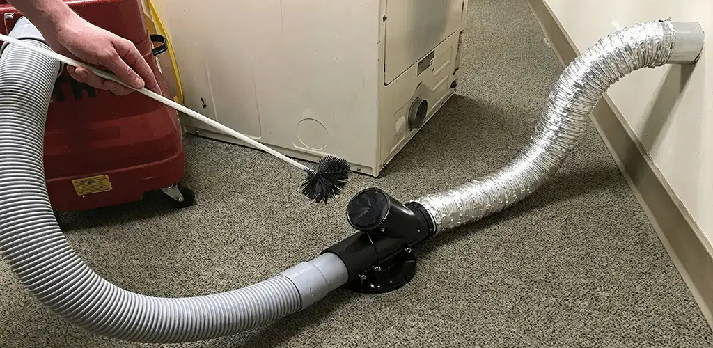 Dryer vent cleaning service removing lint from a dryer duct connection in Columbia, SC