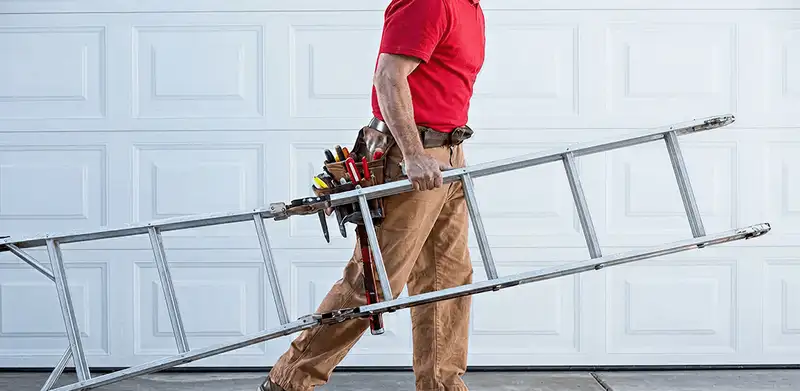 Garage door repair technician arriving with tools and ladder in Columbia, SC
