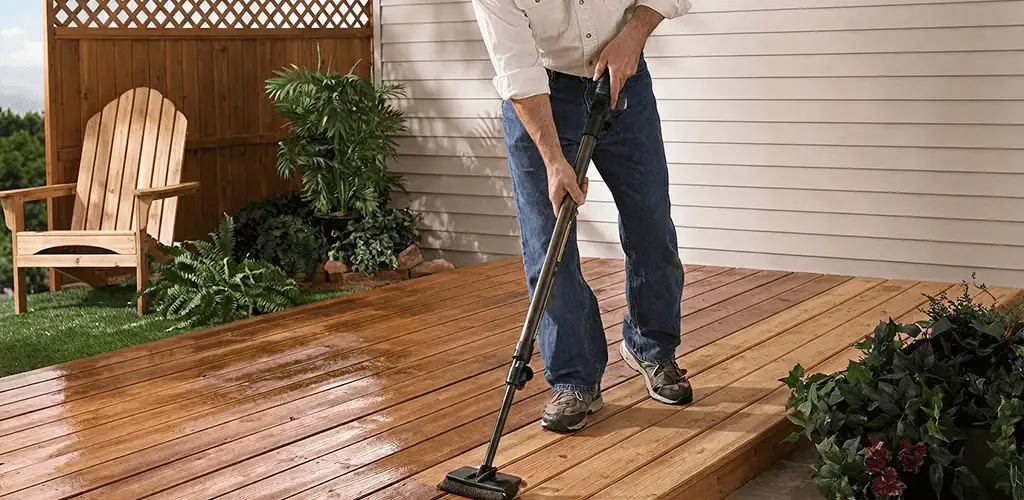 Deck staining service applying stain to a backyard wood deck in Columbia, SC